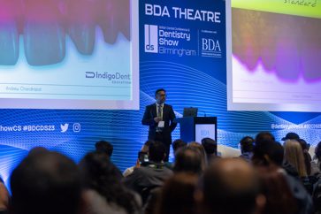 Andrew Chandrapal addresses the audience in the BDA's theatre